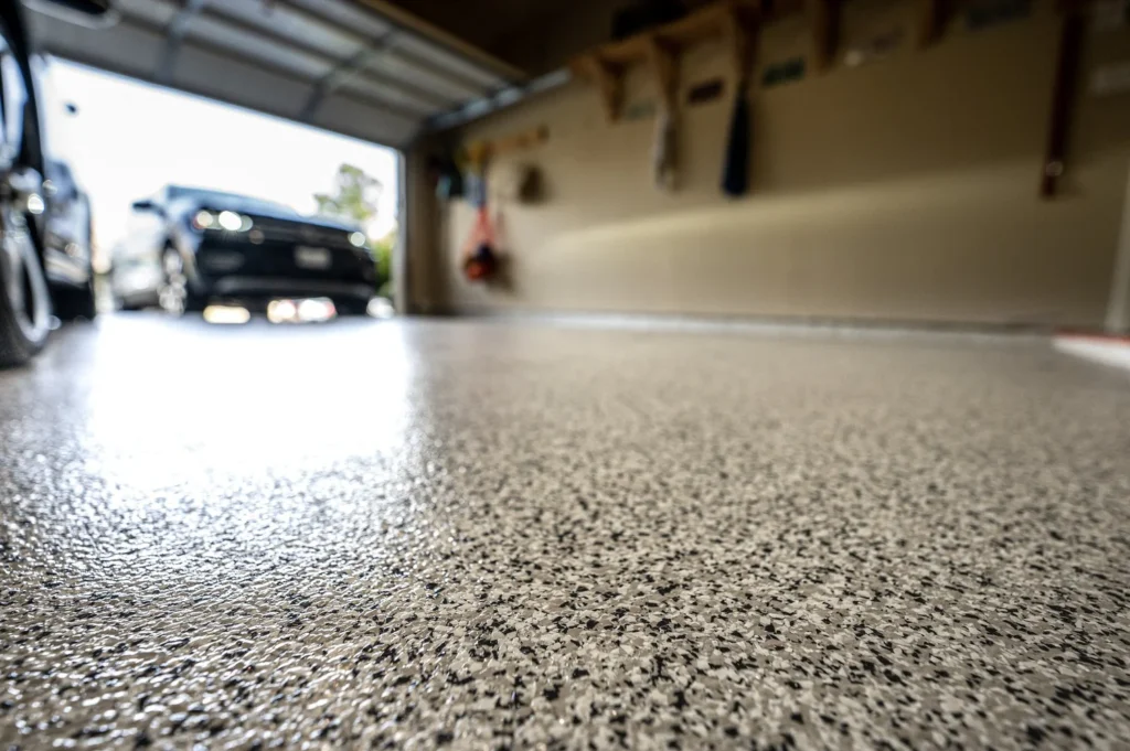 First-Class Floors with Flakes System Greenwich 1 Before and after garage floor transformation using flakes system flooring by Jaks Colors