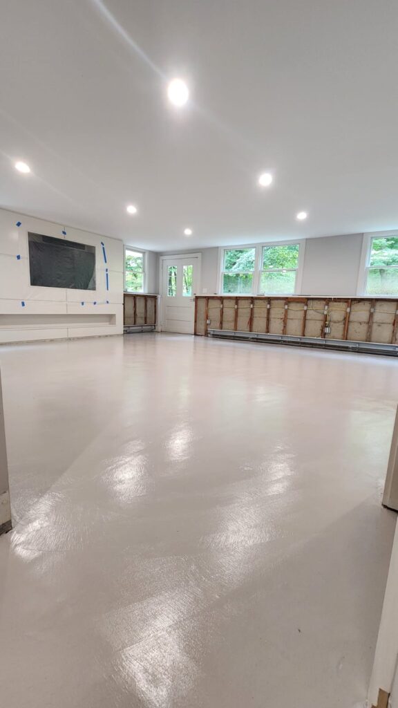 Microtopping floor in a modern kitchen in Greenwich, offering a durable, clean finish.