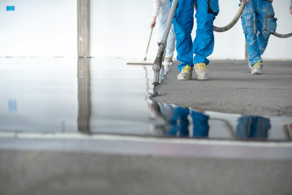 Self leveling concrete floor in a Greenwich office, offering a seamless and smooth finish.