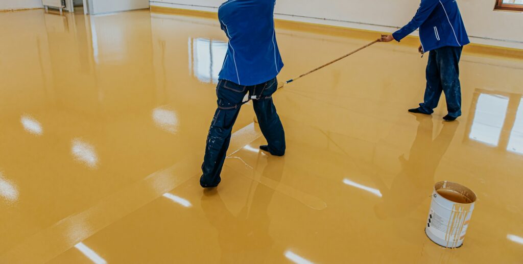 Epoxy quartz floor in a commercial kitchen in Greenwich, providing safety and durability.